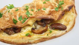 Omelette Tres Quesos con Champiñón